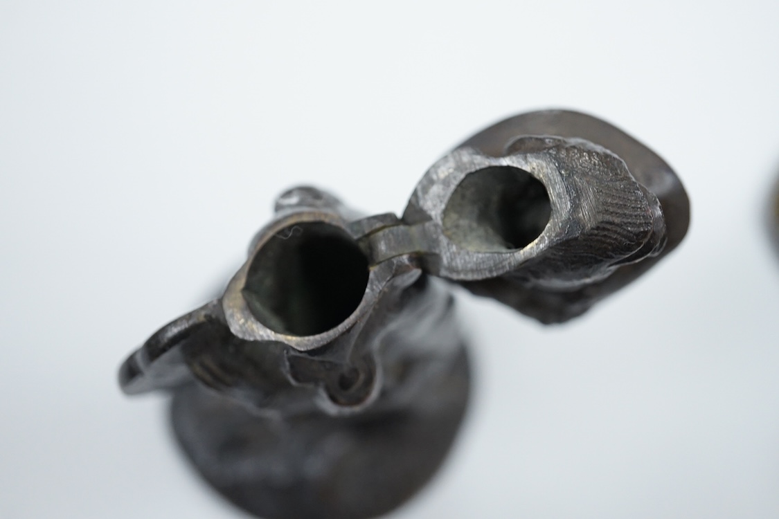 A novelty dog's head Pastille burner and bronze monkey, largest 11cm wide